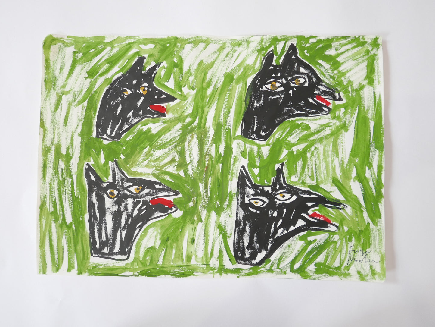 Dog heads on grass