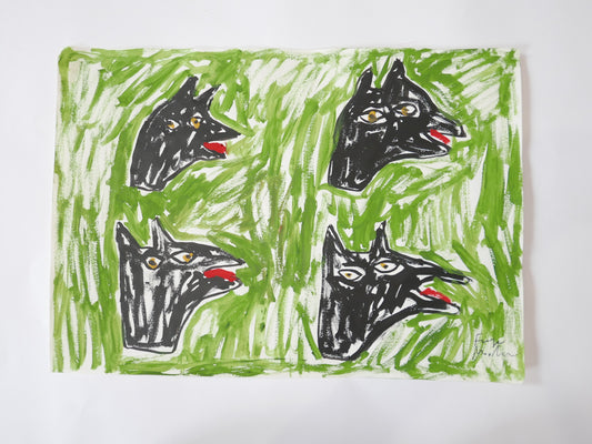 Dog heads on grass