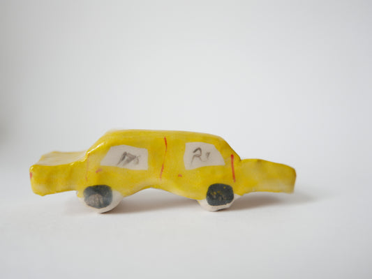 Yellow Car Carrying Bikes