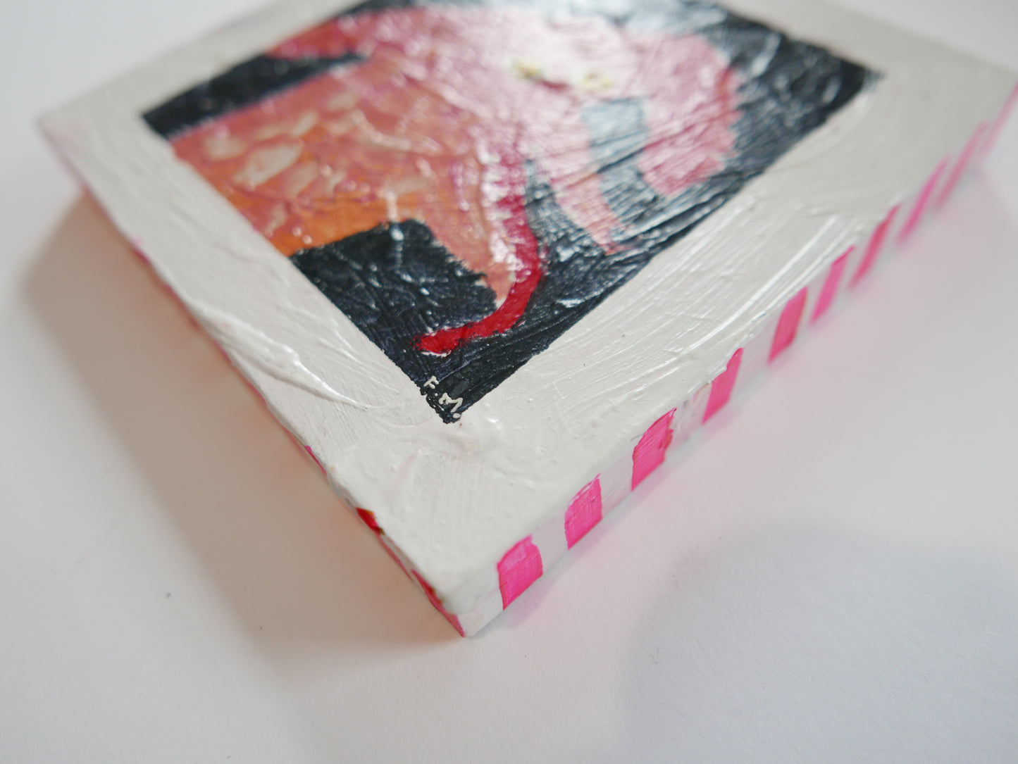 Pink poodle yellow eyes tongue out