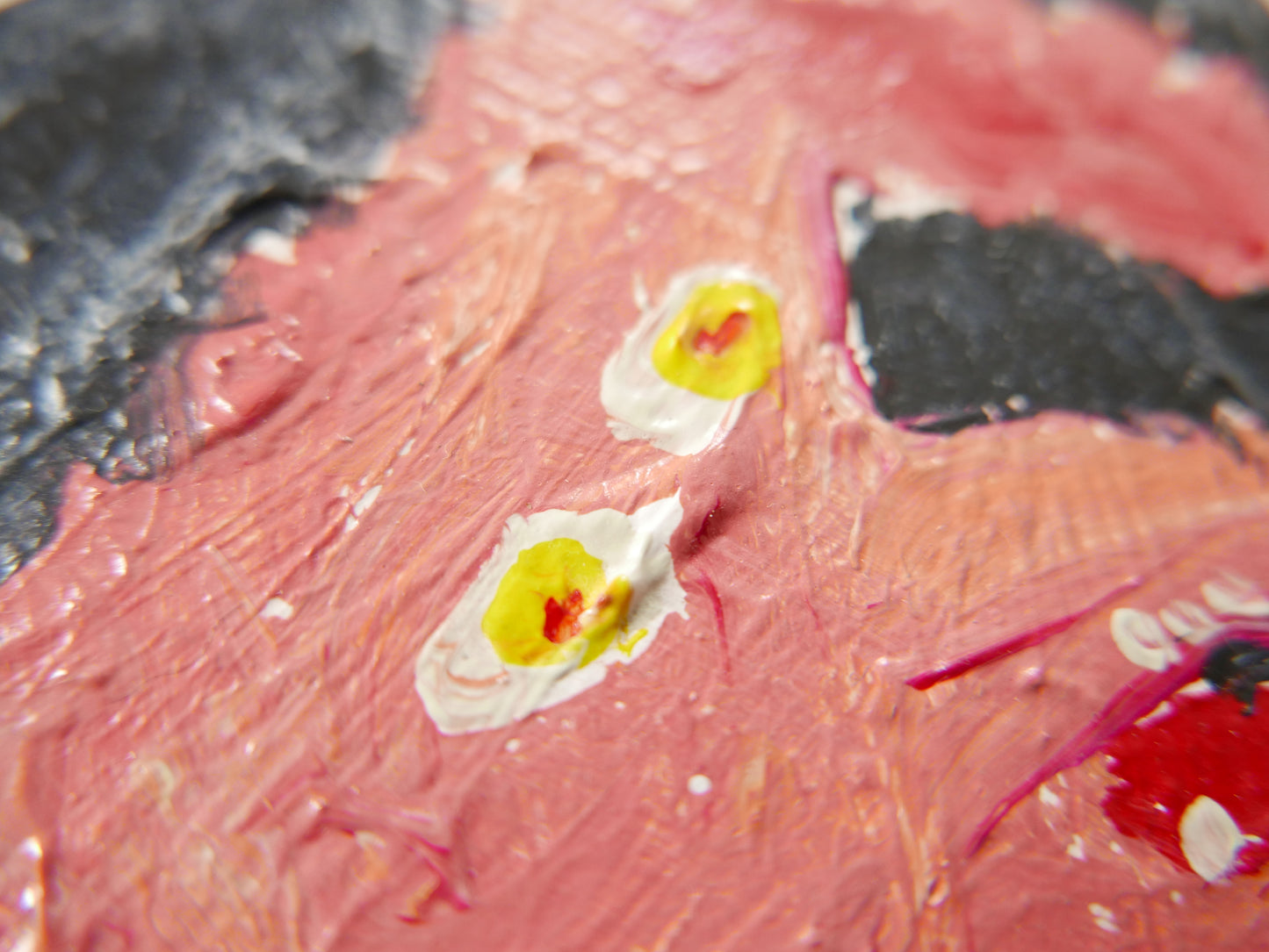 Pink poodle yellow eyes tongue out