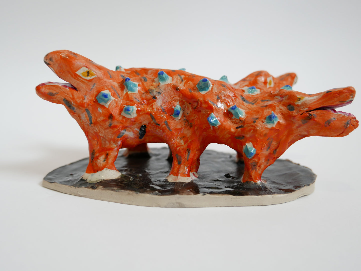 Orange Dog with Blue Chicken Pox and Four Heads and Six Feet